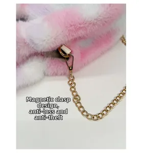 Detail of plush bucket bag featuring a magnetic closure and golden metal chain link