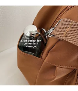 Detail view of the functional side storage pocket on this large canvas tote bag