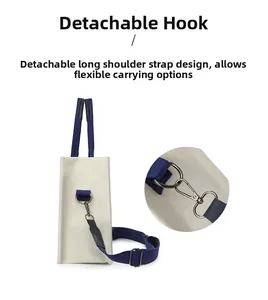 Détail du crochet métallique amovible et de la bandoulière bleue du sac cabas en toile