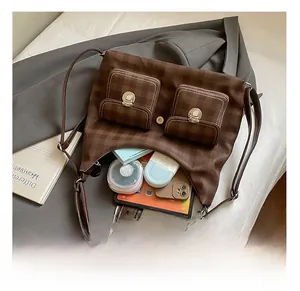 Macro shot showing internal capacity of checkered tote bag with tablet and daily essentials