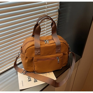 Brown nylon tote bag with reinforced handles and adjustable wide crossbody strap
