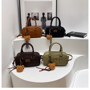 Chic frosted bowling bags in four colors with cute bear pendants and striped ribbons