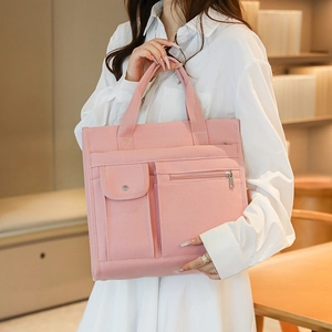 Pink felt tote bag with multi-functional pocket compartments and snap closure detail