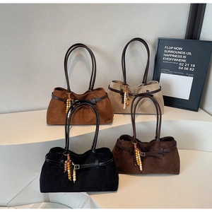 Group display of four vintage suede tote bags in black, dark brown, caramel, and apricot