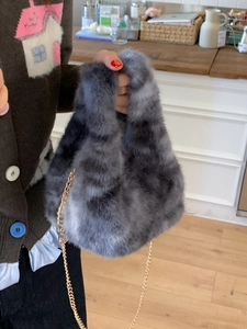 Winter fluffy faux fur tote bag in grey and black mottling with golden metal chain strap