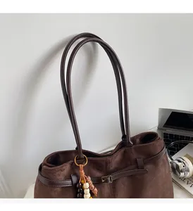 Deep brown faux suede tote bag with metal buckles and colorful bead charm decoration