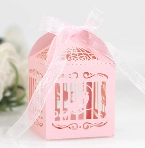 Pink laser-cut birdcage candy gift box with elegant ribbon bow for wedding party favors