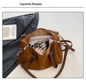 Spacious interior of a vintage leopard-print suede bag showing everyday essentials