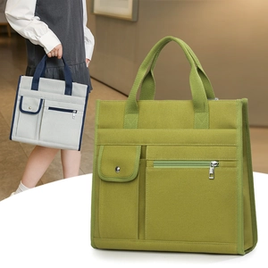 Detail of durable canvas tote with reinforced handles and secure metal buckle pocket