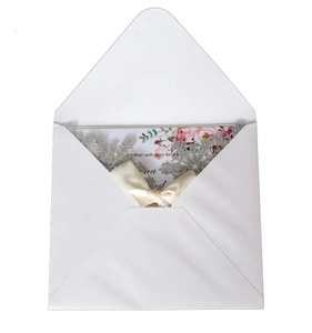 Silver laser-cut snowflake wedding invitation set with floral card and satin bow