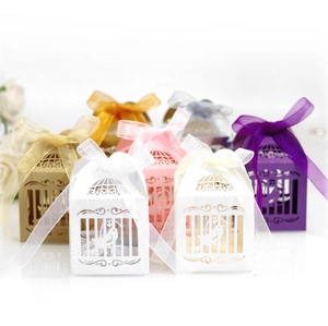 Laser-cut bird cage wedding candy boxes with ribbons in multiple elegant colors