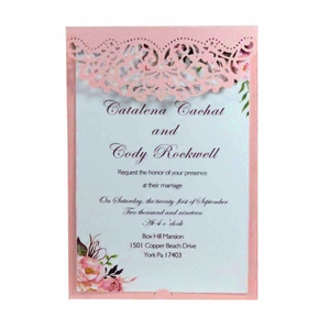 Detailed laser-cut hollow pink floral wedding invitation with an elegant cardstock insert