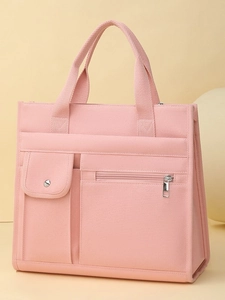 Pink minimalist canvas tote bag with front multi-pocket design and spacious storage