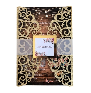 Laser cut wedding invitation with gold glitter cover and vellum belly band