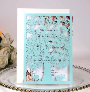 Laser cut blue invitation set with owl tree design, white insert card and matching envelope