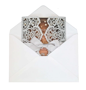 Elegant laser-cut glitter wedding invitation set with silver ribbon and wooden style card