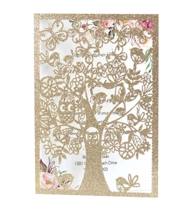 Golden glitter laser cut invitation featuring a hollow tree and owl with floral inner card