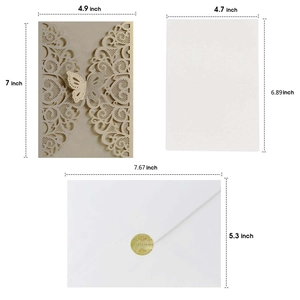 Champagne gold laser-cut butterfly wedding invitation set with white inserts and envelopes