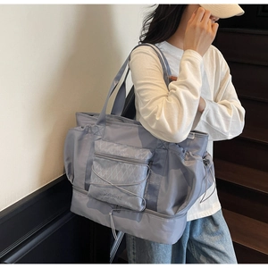 Detail of lavender travel bag showing shoe compartment and durable nylon fabric texture