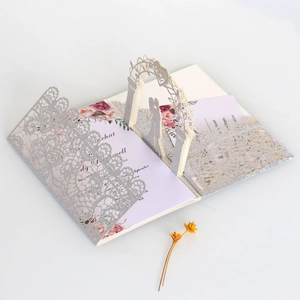 3D laser-cut silver glitter wedding invitation with romantic couple arch silhouette