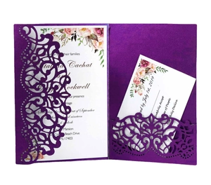 Detail view of laser-cut wedding invitation set in dark purple pearlescent paper