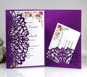 Detail of purple laser-cut wedding invitation set with intricate floral mandala patterns