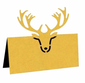 Detail of laser-cut reindeer head golden place card for wedding or Christmas tables