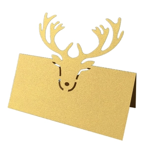 Laser-cut reindeer place cards in shimmering gold cardstock for festive table settings