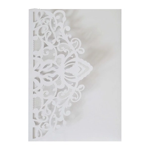 Detailed laser-cut white wedding invitation card with intricate floral lace texture
