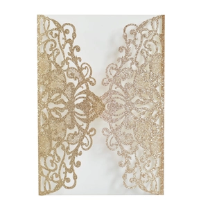 Detailed laser-cut gold glitter wedding invitation cover with intricate floral lace pattern