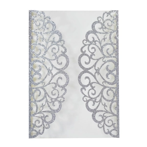 Detail of silver glitter laser-cut invitation cover with elegant floral patterns