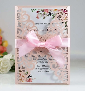 Elegant laser-cut heart wedding invitation with pink ribbon and floral inner page