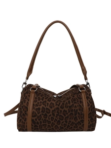 Retro leopard print tote bag with brown leather trim and silver hardware in a full view
