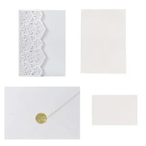 Elegant laser-cut wedding invitation set with white envelopes and sizes in inches