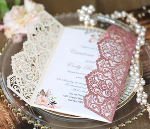 Laser cut glitter wedding invitation with rose gold hollow pattern and floral details