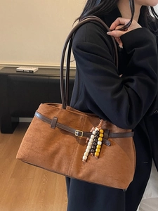Vintage brown suede tote bag with leather strap and decorative colorful bead tassel