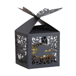 Elegant black laser-cut candy gift box with hollow floral patterns and butterfly top closure