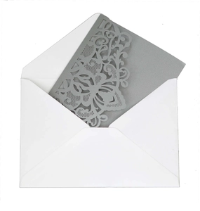 Detailed laser cut lace patterns on elegant silver wedding invitation cards with envelopes