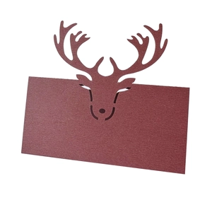 Laser-cut burgundy reindeer place card made of textured paper for Christmas table settings