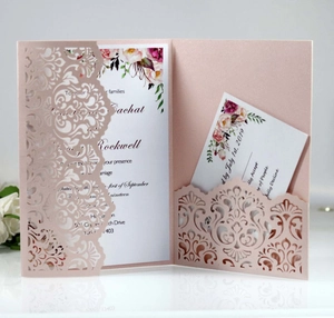 Detail view of laser-cut floral wedding invitation set with pearl pink pocket and inserts