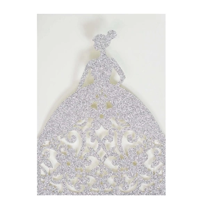 Macro detail of laser-cut silver glitter wedding invitation with elegant female silhouette