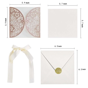 Macro detail of laser-cut rose gold glitter wedding invitation with ivory silk ribbon
