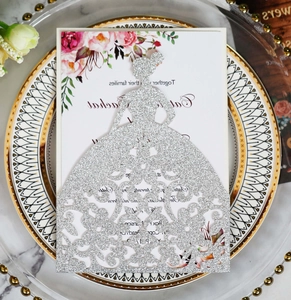 Detail of silver glitter laser-cut girl shape wedding invitation with floral insert