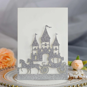 Detailed laser cut silver glitter wedding card featuring a castle and horse carriage