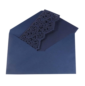 Detail of laser-cut floral pattern on navy blue wedding invitation with V-flap envelope