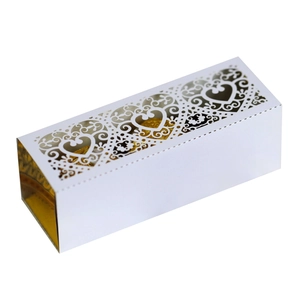 Detailed laser-cut heart hollow pattern on white and gold wedding favor gift box
