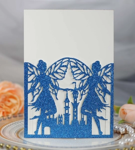 Detail of laser-cut fairy castle invitation with blue glitter and cream cardstock