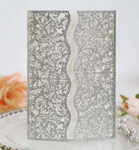 Detailed laser-cut silver glitter wedding invitation card with elegant floral patterns