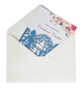 Blue glitter laser cut butterfly wedding invitation with floral insert and white envelope