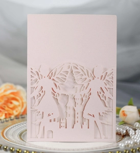Detail of laser-cut fairy and castle invitation card on shimmering light pink pearl paper